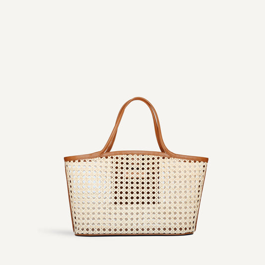 Forstera Handwoven Rattan Basket Bag with premium leather handles—an artisanal blend of rustic texture and modern elegance, perfect for everyday sophistication